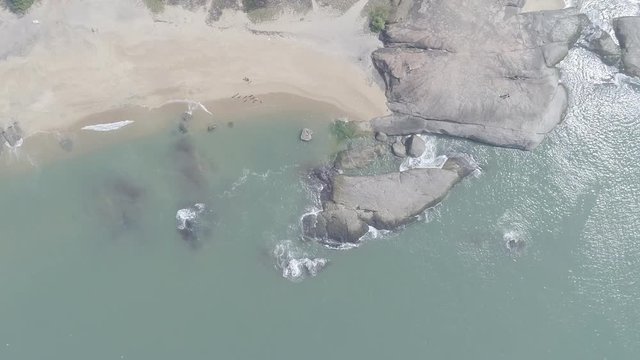 descending drone footage of beach waves - FLAT ungraded footage