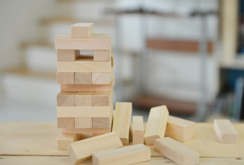 failed tumbling tower on the wooden table