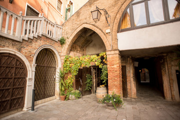 Fototapeta na wymiar Venice Street with Ancient Buildings Made from Red Bricks.