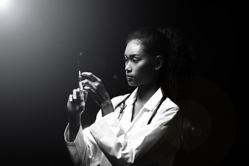 Doctor Nurse woman in uniform with stethoscope and syringe