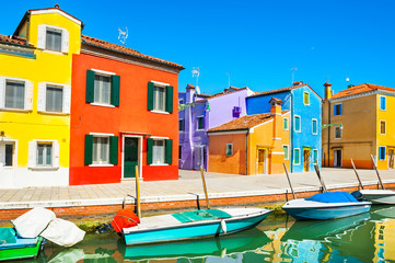 Fototapeta na wymiar Scenic canal with colorful buildings in Burano island, Venice, Italy