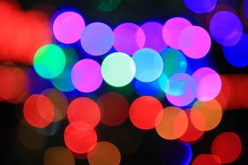 Colored bright bokeh festive background.
