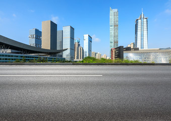 Fototapeta na wymiar empty asphalt road and modern commercial office buildings in shenzhen