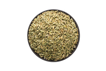 anise seeds in clay bowl isolated on white background. Seasoning or spice top view