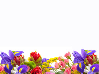 Bright spring bouquet of tulips, roses, irises on a white background © urika