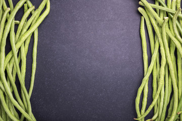 Top view fresh green cowpea or Asparagus bean on black stone