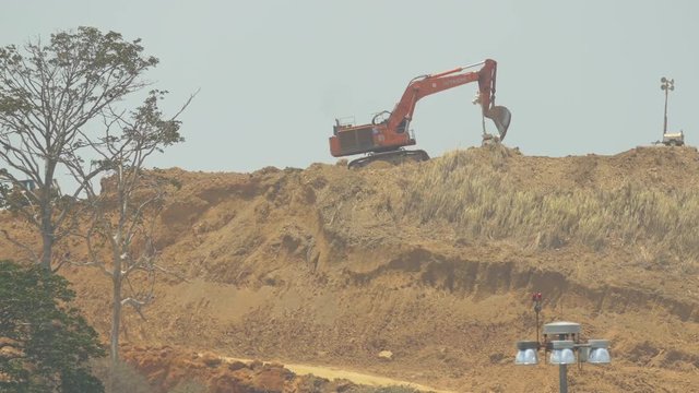 Cat Excavator On A Hill