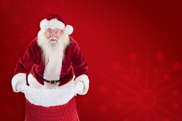 Santa open his red bag against red background