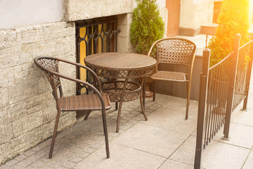 A tables and many chairs on a terrace