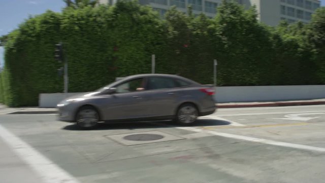 Front view of a Driving Plate: Car traveling on Pico Boulevard in Santa Monica, California, turns right onto Main Street and continues, turns right onto Olympic Drive, and continues to the intersection with 4th Street.