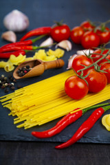 Different pasta on a dark  background.