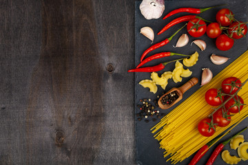 Different pasta on a dark  background.