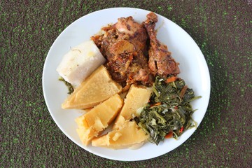 Homemade Creole chicken with breadfruit and yam served in the Caribbean