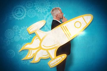 Thoughtful mature businessman posing against blue background