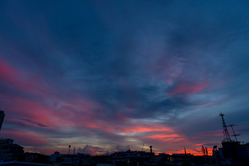 Silhouette of cellular tower with beautiful sunset cloudy sky