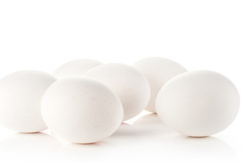 White chicken eggs stack isolated on white background.