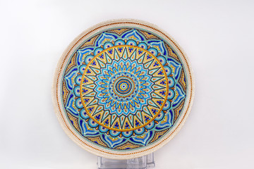 Decorative ceramic dish painted with hands. Art, handmade.