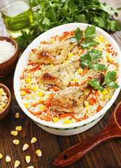 Chicken legs baked with rice and vegetables