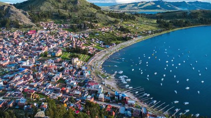 Timelapse of the town of Copacabana and the lake of Titicaca, Bolivia. Day to night timelapse with vertical panorama