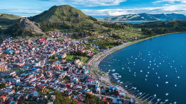 Timelapse of the town of Copacabana and lake of Titicaca, Bolivia. Day to night time lapse