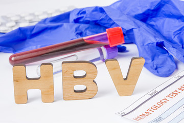 HBV Medical acronym or abbreviation of hepatitis B virus in laboratory test diagnostics and physical diagnosis. Word HBV is near blood sample in lab tube, protection glove, blood test and medications