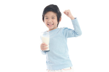 child drinking milk from a glass