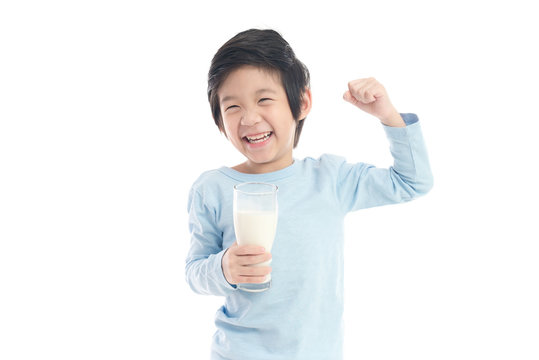 Child Drinking Milk From A Glass