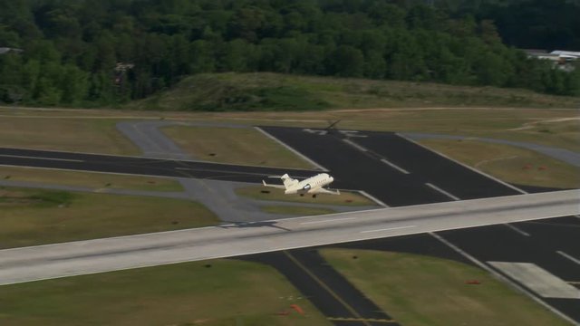 Control tower view of jet taking off and turning left