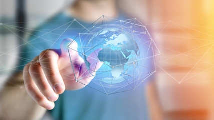 Businessman holding a Connected network over a earth globe concept on a futuristic interface - 3d rendering