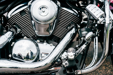 Closeup of motorbike with lots of chrome details. Modern powerful perfomance road motorcycle shiny...
