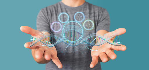 Obraz premium Businessman holding a 3d render DNA