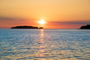 Incredibly beautiful romantic landscape with sunset at sea between the islands (vacation, rest, harmony, meditation, honeymoon - concept)