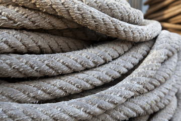 Thick braided rope. Texture of a braided rope. Fishing net.