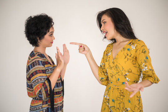 Two women arguing and distrusting each other