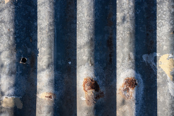 Shadows on rusted corrugated iron sheet