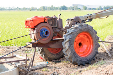 Agricultural engine pumping into rice paddy fields.