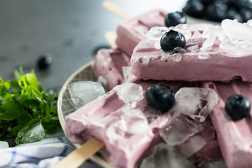 Blueberry popsicle ice cream on a dark background