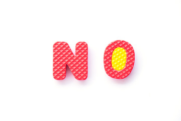 Color toy foam alphabet in word no on white background
