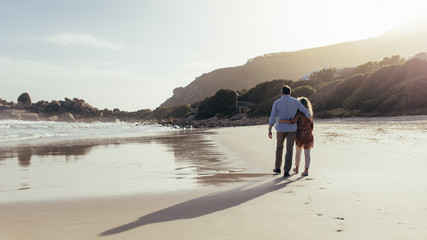 Loving mature couple on a beach walk