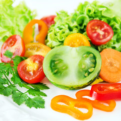 Obraz na płótnie Canvas Green tomatoes and salad