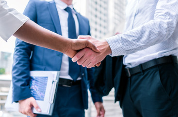 handshake of business People Colleagues Teamwork Meeting .Hold hand and shaking hand in city