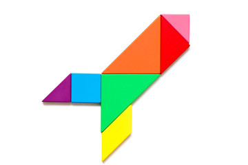 Color wood tangram puzzle in rocket or missile shape on white background