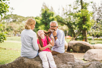 happy family playing in garden park