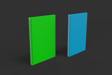 Two notebooks with spiral bound on black background