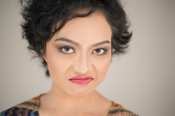 Young woman envy on  white background