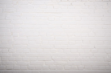 White brick wall background abstract texture of painted genuine clay blocks of masonry work