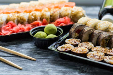 Sushi set: sushi roll with salmon and sushi roll with smoked eel, selective focus.