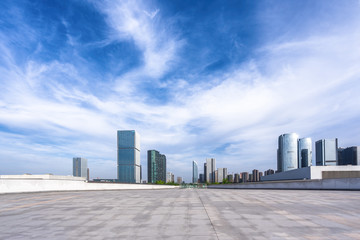 empty marble floor with city skyline