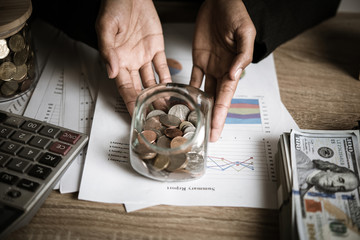 Silver coins in hands