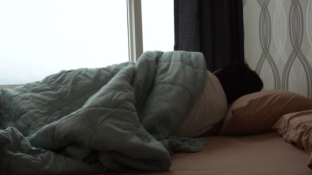 Man trying to sleep in the morning